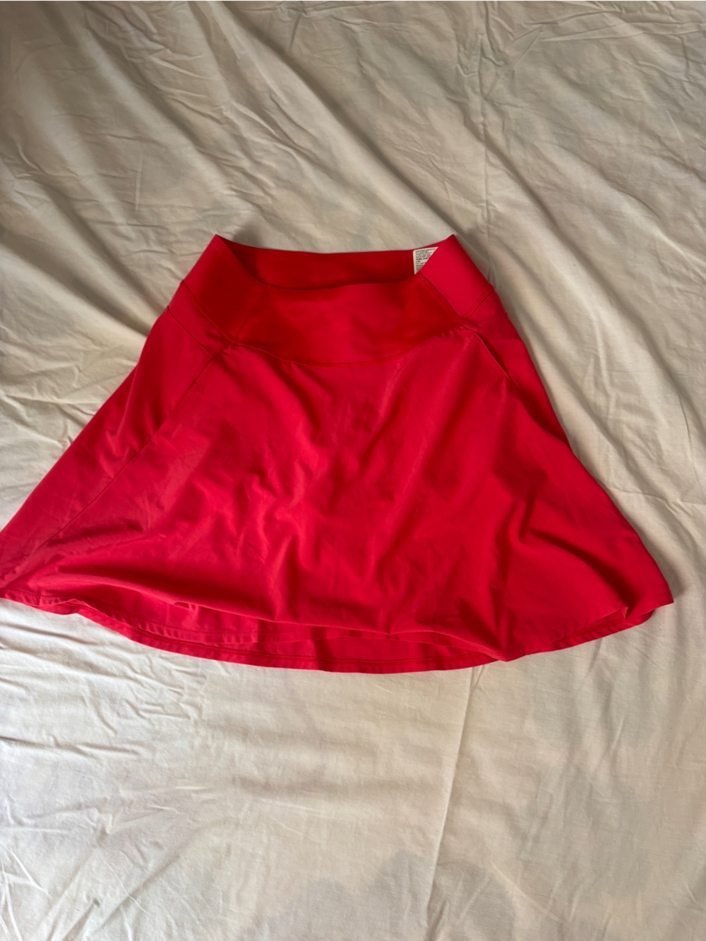 Neon magenta puma circle skirt. Built in shorts. Size large.